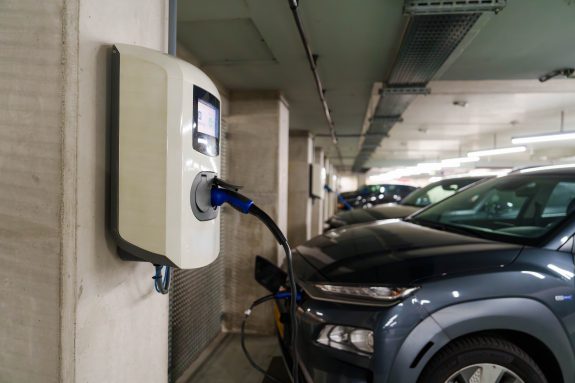 Electric cars in an underground car park at a charging station
